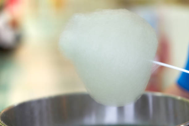 istock Cooking of candy floss on stick  for sell 1148743146