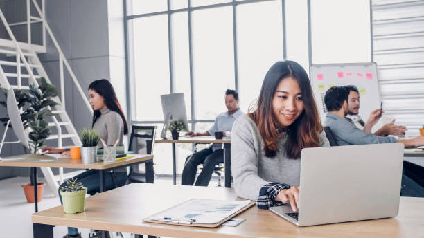 istock Group of diversity creative designer working at modern office building.casual office lifestyle with technology 1148743577