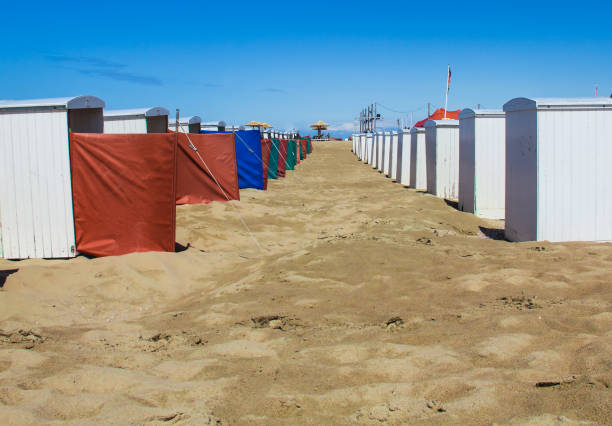 Typical Dutch beach with houses in Katwijk, the Netherlands Empty Dutch beach with houses in beginning of vacation season , Katwijk, the Netherlands hollandaise sauce stock pictures, royalty-free photos & images