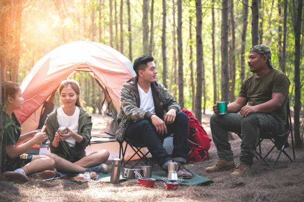 istock Young asian people hiking in the forest. 1148746963