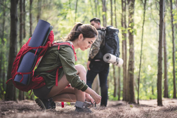 istock Young asian people hiking in the forest. 1148746993