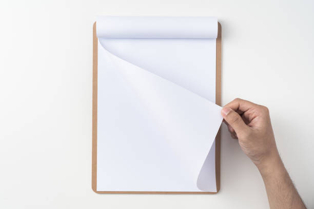istock white flipped paper on clipboard isolated on white 1148749924