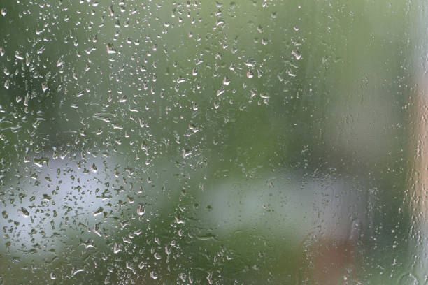 istock Raindrops on window glass during the rain close up. Natural background 1148749925