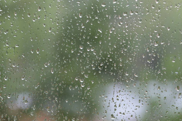 istock Raindrops on window glass during the rain close up. Natural background 1148749938