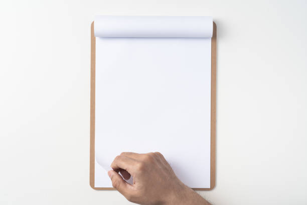 istock white flipped paper on clipboard isolated on white 1148749944