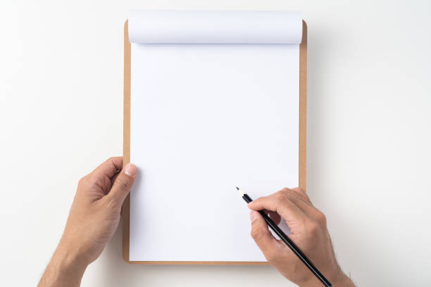 istock white flipped paper on clipboard isolated on white 1148750474