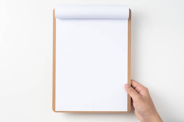 白に分離されたクリップボード上の白いフリップ紙 - turning list ストックフォトと画像