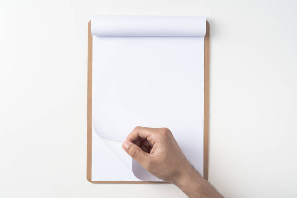 istock white flipped paper on clipboard isolated on white 1148750999
