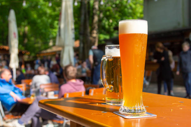 istock A wheat beer and a pils are standing on a table in a beer garden 1148752233