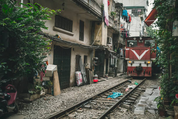 istock A train run through an ancient town in Hanoi. 1148755977