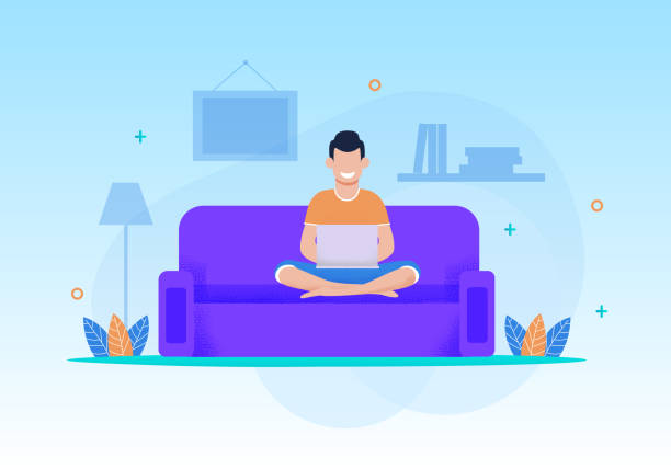 Smiling Man Relaxing with Laptop at Home Cartoon Smiling Man Play Video Game, Type in Social Chat Using Laptop Sitting on Sofa at Living Room. Relax or Working on Comfortable Couch on Evening or Weekend at Home. Flat Vector Cartoon Illustration game developer stock illustrations