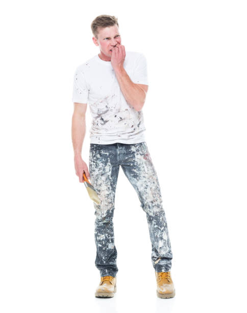 istock Young attractive male painter standing on white background - emotional stress 1148757107