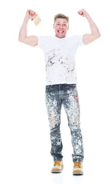 istock Young attractive male painter standing on white background - excited 1148757190