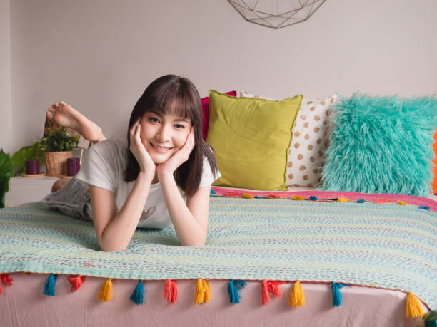 istock Woman lying on the chin in bed 1148757442