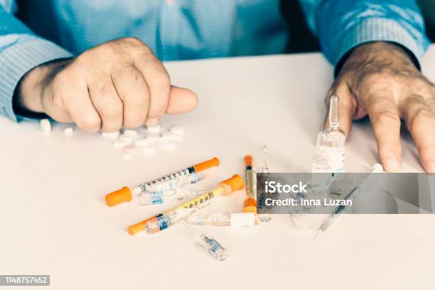 Medicine Pills Or Capsules With Manu2019s Hands On White Background With Copy Space Stock Photo - Download Image Now