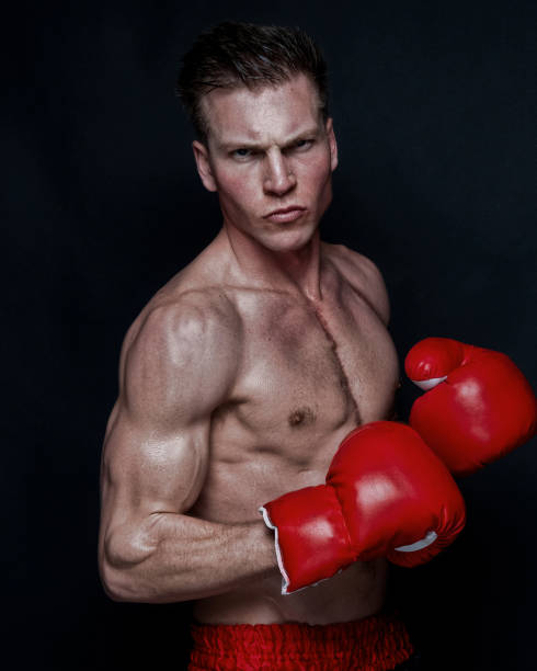 istock Sexy male boxer on black background 1148758710