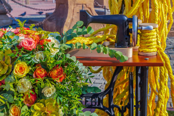 Timisoara: Beautiful floral decoration with an old sewing machine and symbolic sewing thread. Liberty Square on the occasion of the Flower Festival organized by the City Hall.
