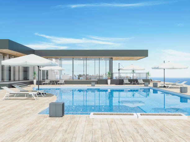 современный дом с бассейном - swimming pool infinity pool patio sea стоковые фото и изображения