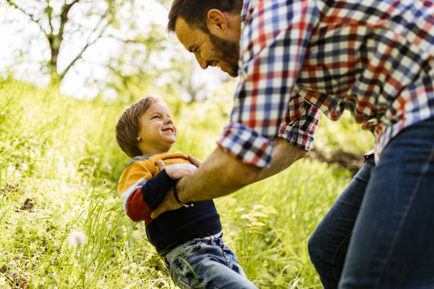 istock Happy father having fun with his small son in the park. 1148763491