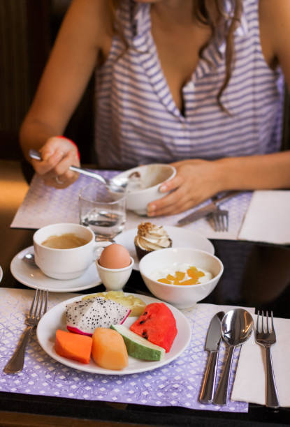 istock healthy breackfast  with exotic  fruits egg yogurt and coffee 1148766106