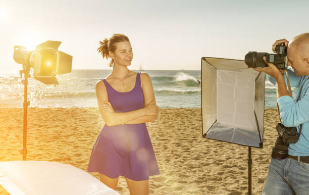 istock Woman posing for photographer on seaside 1148766652