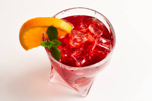 istock Red fresh drink with ice, grapefruit and mint isolated on white. Space for text or design. 1148767280