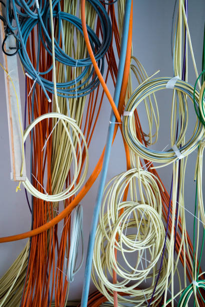 istock colorful electrical cables hanging from the ceiling in spirals and bundles 1148774051