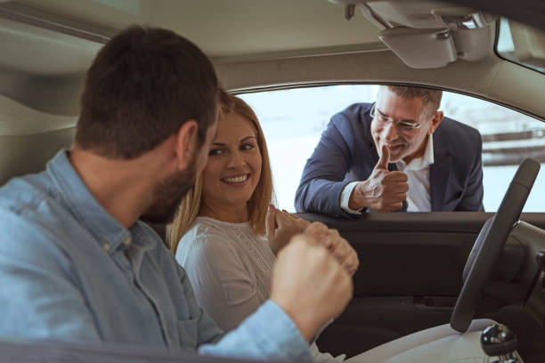 istock Car seller showing thumbs up 1148774568