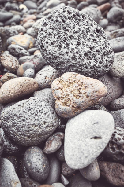 istock Natural background made of volcanic rocks and pebbles. 1148776659