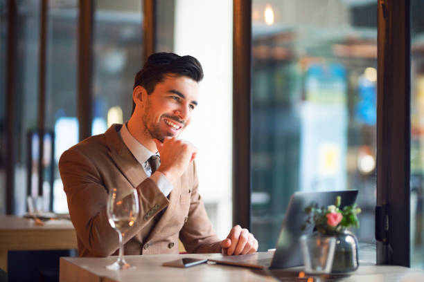 istock Enjoying your work with a glass of wine 1148776768