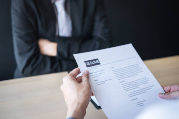 istock Midsection Of Man Giving Interview To Manager At Office 1148778529
