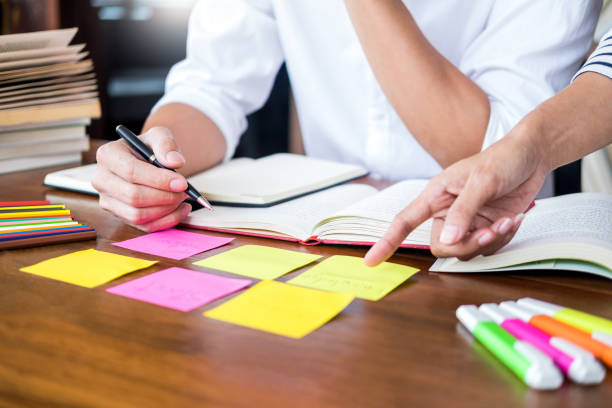 istock Colleagues Working At Desk In Office 1148778699
