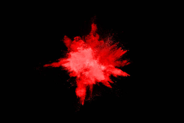 istock abstract red powder explosion on black background.abstract red powder splatted on black background. Freeze motion of red powder exploding. 1148780940