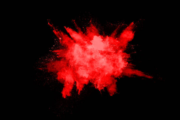 istock abstract red powder explosion on black background.abstract red powder splatted on black background. Freeze motion of red powder exploding. 1148780948