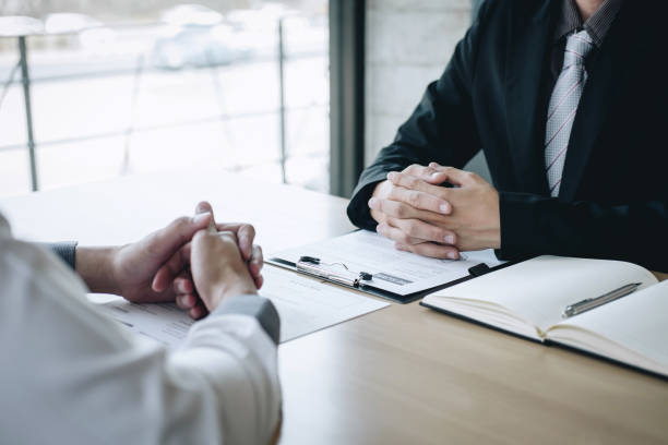 istock Midsection Of Manager Taking Interview Of Candidate On Table 1148781359