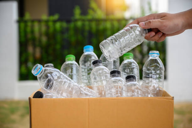 istock man hand putting plastic reuse for recycling concept environmental protection world recycle 1148781566