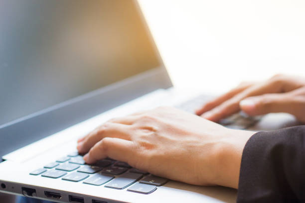 istock Close-Up Of Woman Using Laptop In Office 1148785012