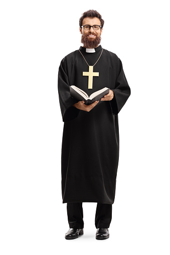 Full length portrait of a father priest with a cross and bible isolated on white background