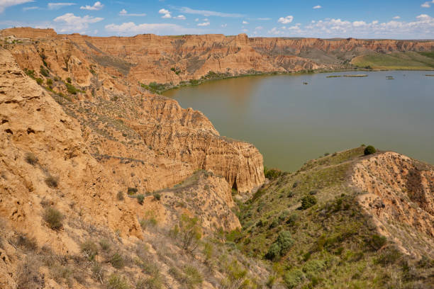 istock Red clay erosion gully and river. Eroded landscape. Spain 1148787365