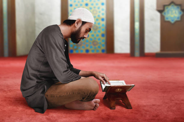 istock Muslim man reading holy quran 1148787468