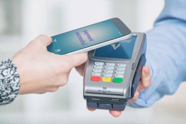 istock Paying contactless with smart phone 1148789212