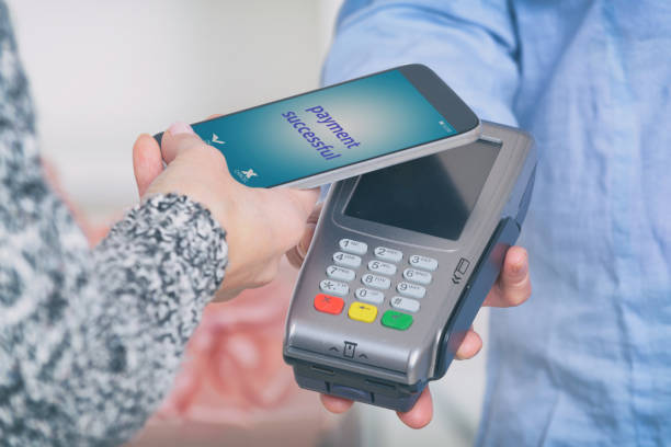 istock Paying contactless with smart phone 1148789753