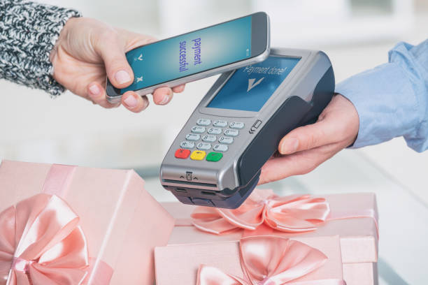 istock Paying contactless with smart phone 1148789785
