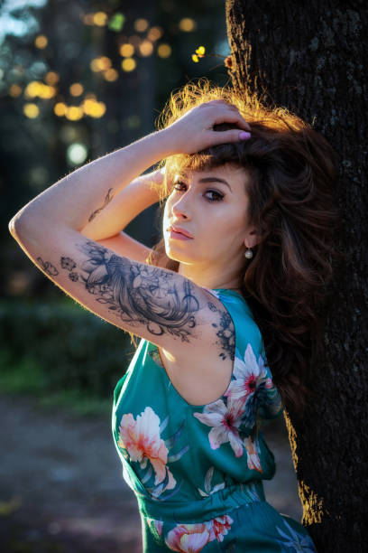istock Fashion model with tattoo posing in the evening. 1148790184