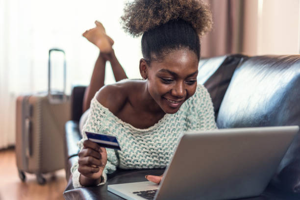 istock Woman making reservations on-line from home 1148791753