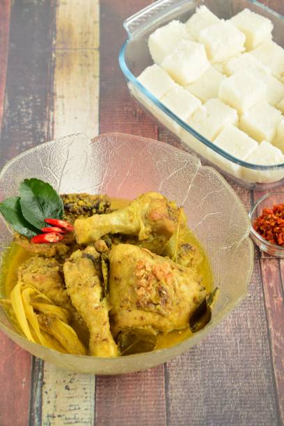 istock Opor ayam, chicken cooked in coconut milk from Central Java, Indonesia. Served with lontong and sambal. Popular dish for lebaran or Eid al-Fitr 1148793336