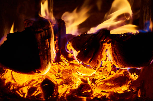 istock Beautiful red flame of fire on oak wood. 1148794272