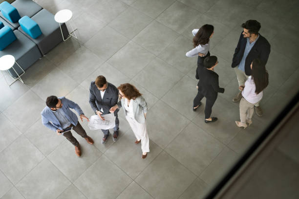istock Confident business partners walking down in office building and talking 1148794888