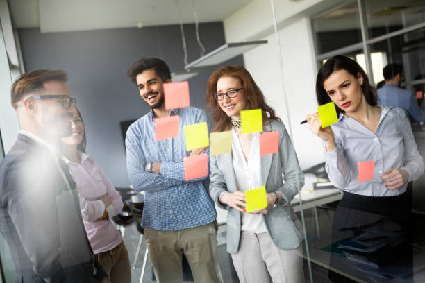 istock Group of business people collaborating in office 1148795007