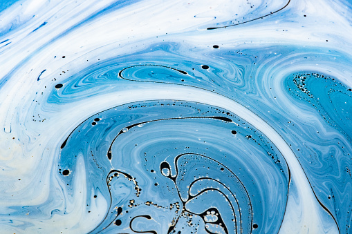Soap bubble closeup. Abstract liquid background